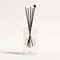 Cassis reed diffuser - glass bottle with rattan reeds, product packshot