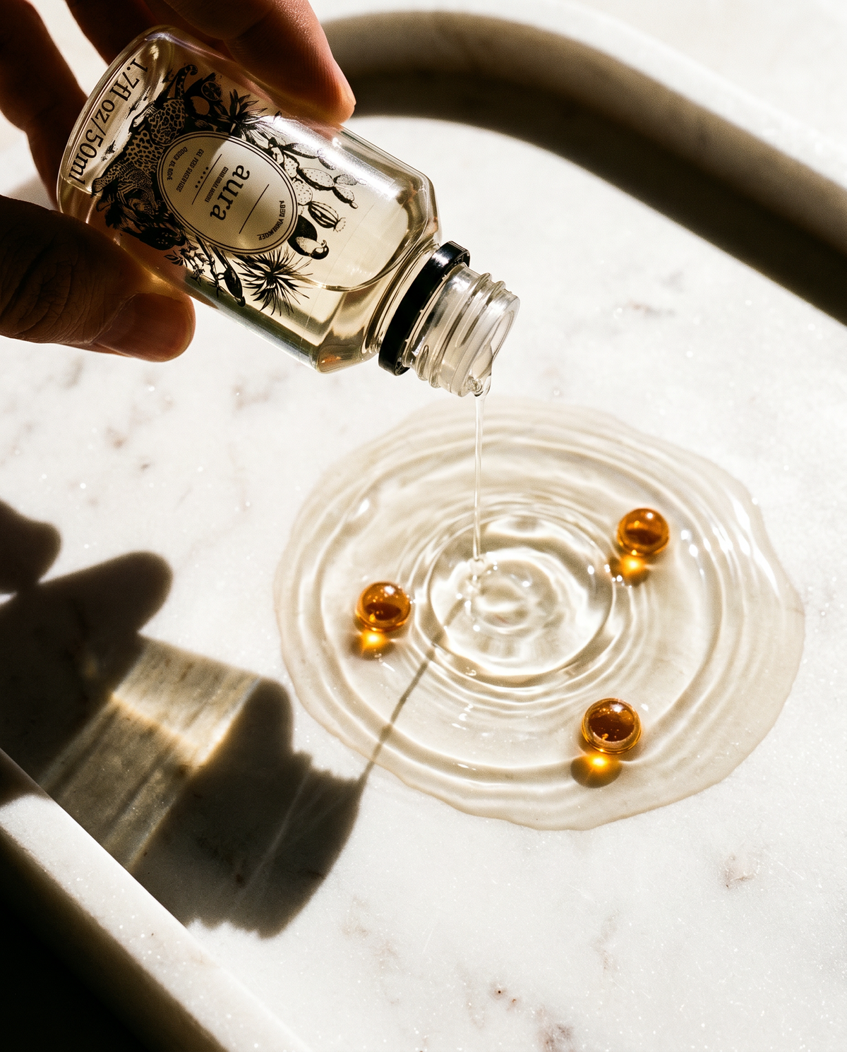 AURA Monaco fragrance oil 50 mL — styled scene 1