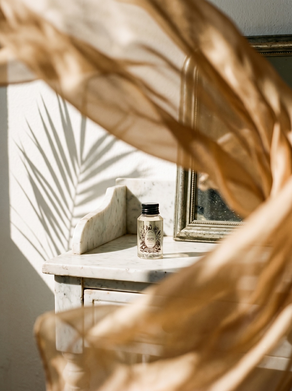 AURA Monaco fragrance oil 50 mL — styled scene 2