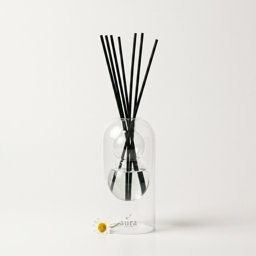 Bella reed diffuser - glass bottle with rattan reeds, product packshot