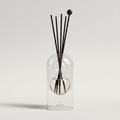 Capri reed diffuser - glass bottle with rattan reeds, product packshot
