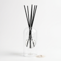 Maddalena reed diffuser - glass bottle with rattan reeds, product packshot